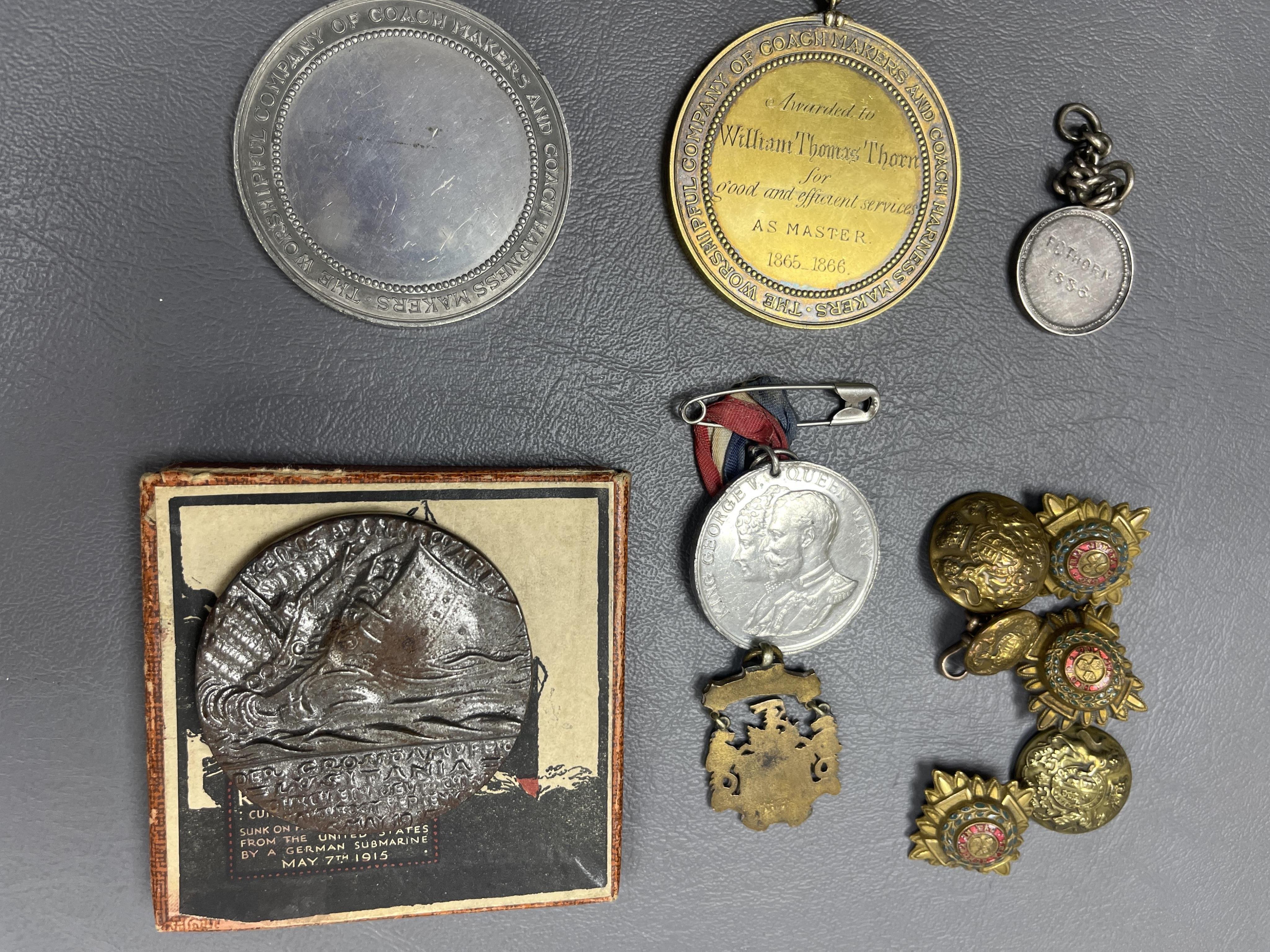 A silver gilt medallion - 'Worshipful Company of Coachmakers and Coach harness makers', engraved 1865-1866 etc, on a suspension link and ribbon, another, in base metal, with a blank recipient field, A London bicycle club